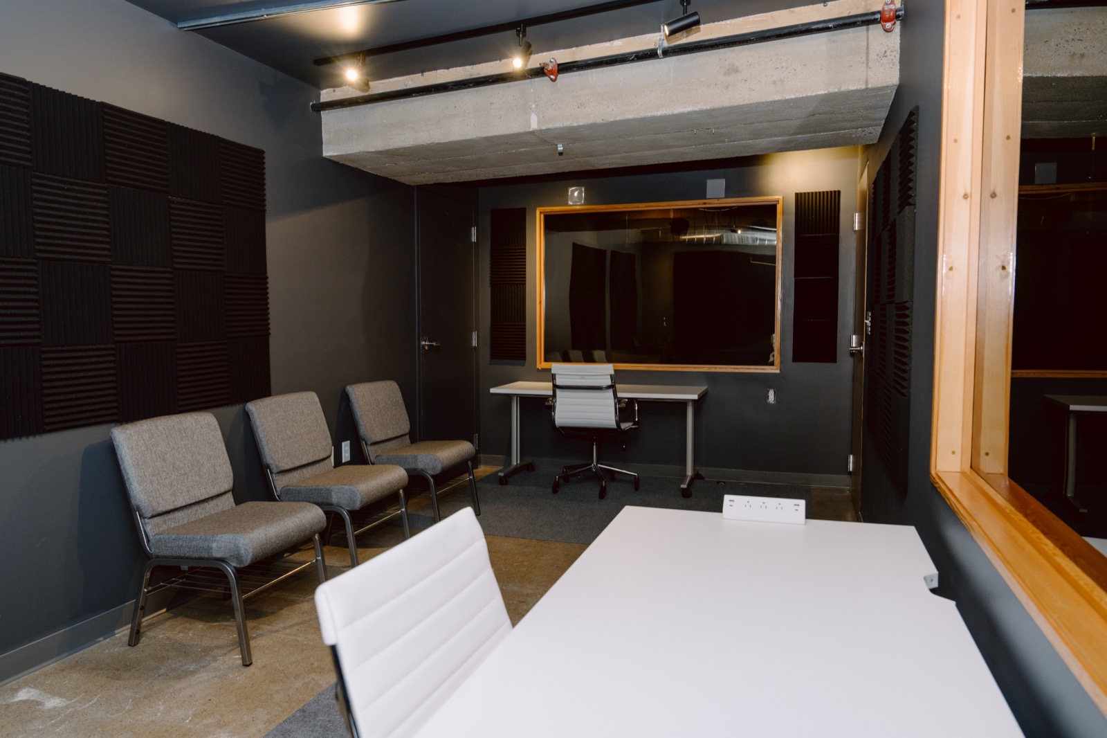 The observation room from the desk, looking toward the mirror and the door